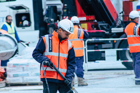 Reims France May 3, 2019 View of unknown people working on the new square of the Reims City Hall in the morningのeditorial素材