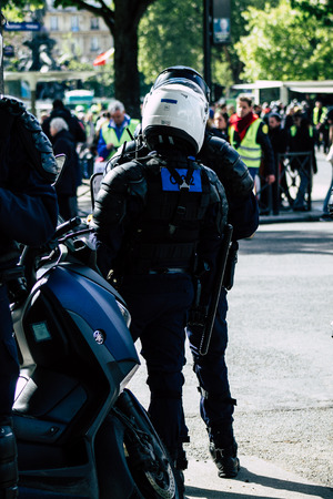 Paris France May 04, 2019 View of a riot squad of the French National Police in intervention during protests of the Yellow Jackets against the policy of President Macron in Paris on saturday afternoonのeditorial素材