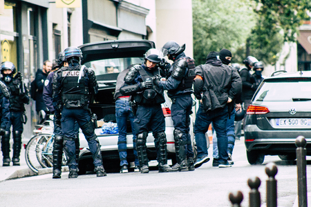 Paris France May 04, 2019 View of a riot squad of the French National Police in intervention during protests of the Yellow Jackets against the policy of President Macron in Paris on saturday afternoonのeditorial素材