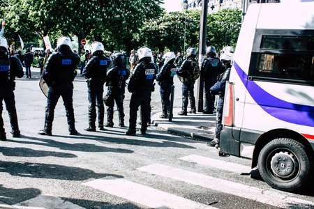 Paris France May 04, 2019 View of a riot squad of the French National Police in intervention during protests of the Yellow Jackets against the policy of President Macron in Paris on saturday afternoonのeditorial素材