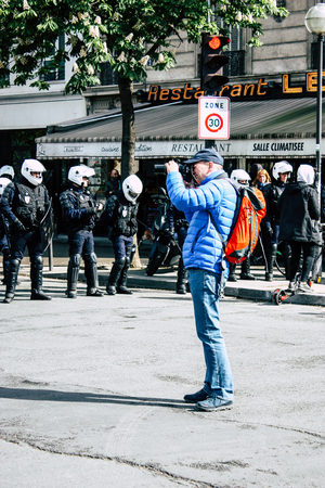 Paris France May 04, 2019 View of press journalist covering protests of the Yellow Jackets against the policy of President Macron in Paris on saturday afternoonのeditorial素材