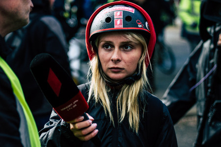 Paris France May 04, 2019 View of press journalist covering protests of the Yellow Jackets against the policy of President Macron in Paris on saturday afternoonのeditorial素材