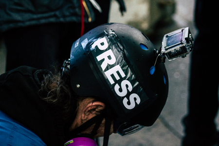 Paris France May 04, 2019 View of press journalist covering protests of the Yellow Jackets against the policy of President Macron in Paris on saturday afternoonのeditorial素材