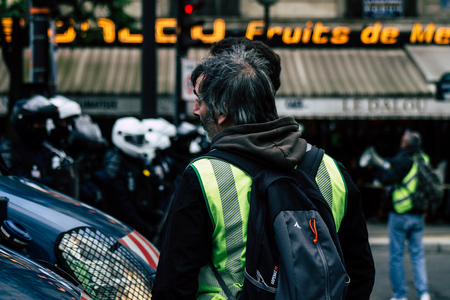 Paris France May 04, 2019 View of press journalist covering protests of the Yellow Jackets against the policy of President Macron in Paris on saturday afternoonのeditorial素材