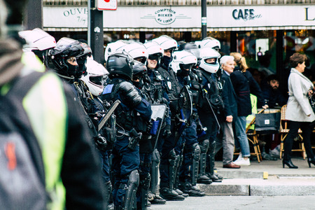 Paris France May 04, 2019 View of a riot squad of the French National Police in intervention during protests of the Yellow Jackets against the policy of President Macron in Paris on saturday afternoonのeditorial素材