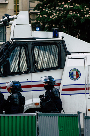 Paris France May 04, 2019 View of a riot squad of the French National Police in intervention during protests of the Yellow Jackets against the policy of President Macron in Paris on saturday afternoonのeditorial素材