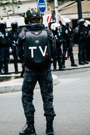 Paris France May 04, 2019 View of press journalist covering protests of the Yellow Jackets against the policy of President Macron in Paris on saturday afternoonのeditorial素材