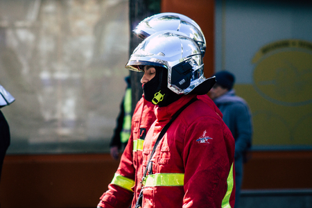 Paris France May 04, 2019 View of a French firefighters walking in the street during protests of the Yellow jackets against the policy of President Macron in Paris on saturday afternoonのeditorial素材