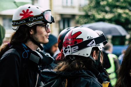 Paris France May 04, 2019 View of French street medic walking in the street during protests of the Yellow jackets against the policy of President Macron in Paris on saturday afternoonのeditorial素材