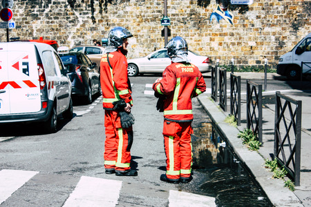 Paris France May 04, 2019 View of a French firefighters walking in the street during protests of the Yellow jackets against the policy of President Macron in Paris on saturday afternoonのeditorial素材