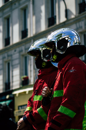 Paris France May 04, 2019 View of a French firefighters walking in the street during protests of the Yellow jackets against the policy of President Macron in Paris on saturday afternoonのeditorial素材