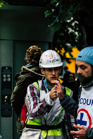 Paris France May 04, 2019 View of French street medic walking in the street during protests of the Yellow jackets against the policy of President Macron in Paris on saturday afternoonのeditorial素材