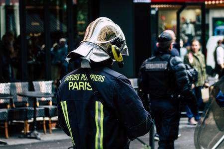 Paris France May 04, 2019 View of a French firefighters walking in the street during protests of the Yellow jackets against the policy of President Macron in Paris on saturday afternoonのeditorial素材