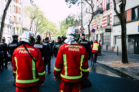 Paris France May 04, 2019 View of a French firefighters walking in the street during protests of the Yellow jackets against the policy of President Macron in Paris on saturday afternoonのeditorial素材