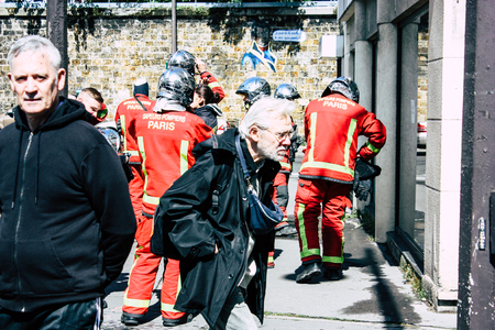 Paris France May 04, 2019 View of a French firefighters walking in the street during protests of the Yellow jackets against the policy of President Macron in Paris on saturday afternoonのeditorial素材