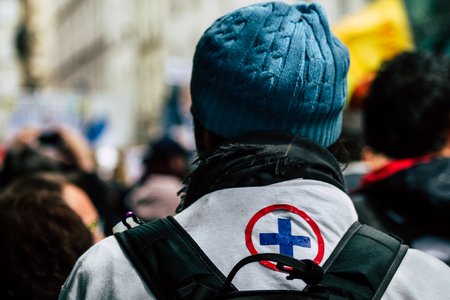 Paris France May 04, 2019 View of French street medic walking in the street during protests of the Yellow jackets against the policy of President Macron in Paris on saturday afternoonのeditorial素材