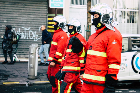Paris France May 04, 2019 View of a French firefighters walking in the street during protests of the Yellow jackets against the policy of President Macron in Paris on saturday afternoonのeditorial素材