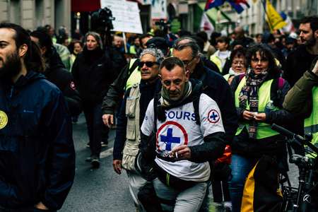 Paris France May 04, 2019 View of French street medic walking in the street during protests of the Yellow jackets against the policy of President Macron in Paris on saturday afternoonのeditorial素材