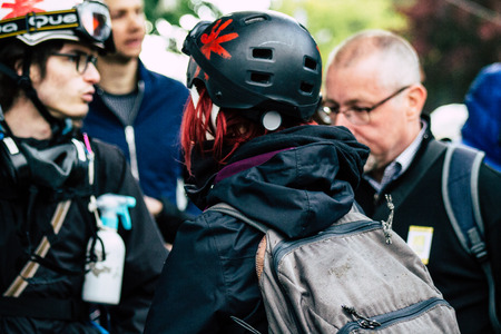 Paris France May 04, 2019 View of French street medic walking in the street during protests of the Yellow jackets against the policy of President Macron in Paris on saturday afternoonのeditorial素材