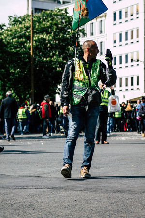 Paris France May 04, 2019 View of Yellow Jackets protesters framed by anti riot police marching against President Macron's policy in Paris on saturday afternoonのeditorial素材