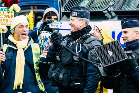 Paris France May 04, 2019 View of Yellow Jackets protesters framed by anti riot police marching against President Macron's policy in Paris on saturday afternoonのeditorial素材