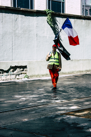 Paris France May 04, 2019 View of Yellow Jackets protesters framed by anti riot police marching against President Macron's policy in Paris on saturday afternoonのeditorial素材