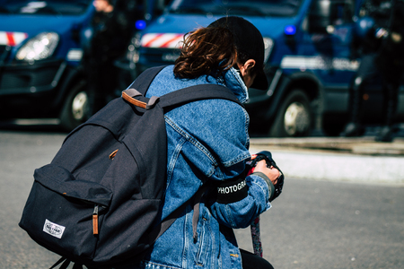 Paris France May 04, 2019 View of press journalist covering protests of the Yellow Jackets against the policy of President Macron in Paris on saturday afternoonのeditorial素材