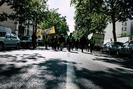 Paris France May 04, 2019 View of Yellow Jackets protesters framed by anti riot police marching against President Macron's policy in Paris on saturday afternoonのeditorial素材