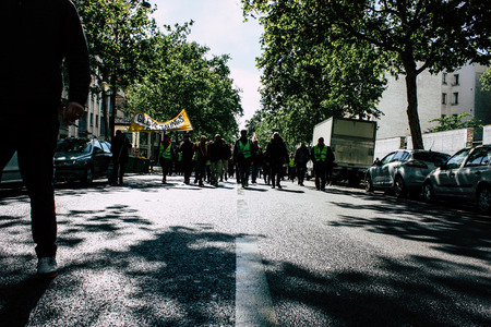 Paris France May 04, 2019 View of Yellow Jackets protesters framed by anti riot police marching...