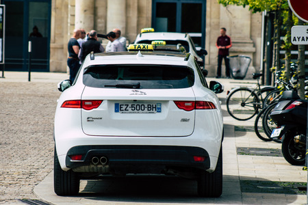 Reims France May 7, 2019 View of a traditional French taxi rolling in the city of Reims in France in the afternoonのeditorial素材
