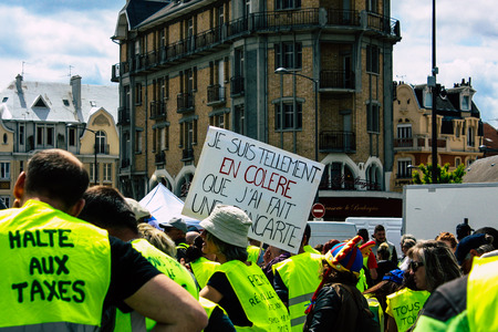 Reims France May 18, 2019 View of unknown Yellow Jackets protesters marching against the policy of President Macron on Saturday afternoonのeditorial素材