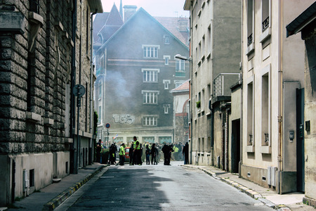 Reims France May 18, 2019 View of unknown rioters walking in the streets of Reims during the protests of the Yellow Jackets against the policy of President Macron on Saturday afternoonのeditorial素材