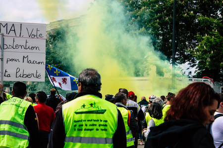 Reims France May 18, 2019 View of unknown Yellow Jackets protesters marching against the policy of President Macron on Saturday afternoonのeditorial素材
