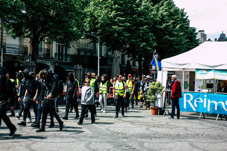Reims France May 18, 2019 View of unknown rioters walking in the streets of Reims during the protests of the Yellow Jackets against the policy of President Macron on Saturday afternoonのeditorial素材
