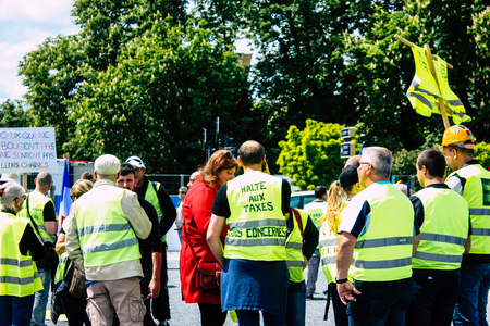 Reims France May 18, 2019 View of unknown Yellow Jackets protesters marching against the policy of President Macron on Saturday afternoonのeditorial素材