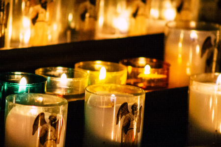 Reims France May 23, 2019 Closeup of holy candles inside of Notre Dame Cathedral of Reims in the afternoonのeditorial素材