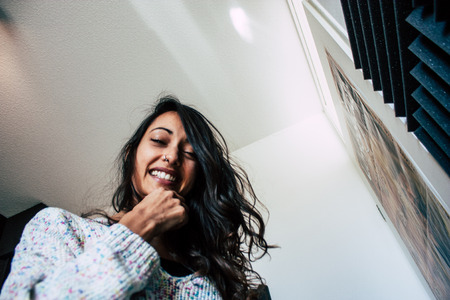 Papendrecht Netherlands April 18, 2019 Portrait of Reachel Singh, Dutch professional songwriter recording the new single, Fly with me, in studio in Netherlandsのeditorial素材