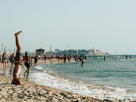 Tel Aviv Israel May 31, 2019 View of unknown Israeli people having fun on the beach of Tel Aviv in the afternoonのeditorial素材