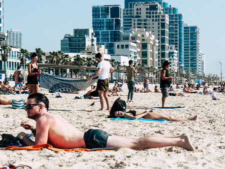 Tel Aviv Israel May 31, 2019 View of unknown Israeli people having fun on the beach of Tel Aviv in the afternoonのeditorial素材