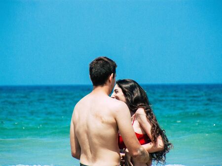 View of unknown Israeli people having fun on the beach of Tel Aviv in the afternoon