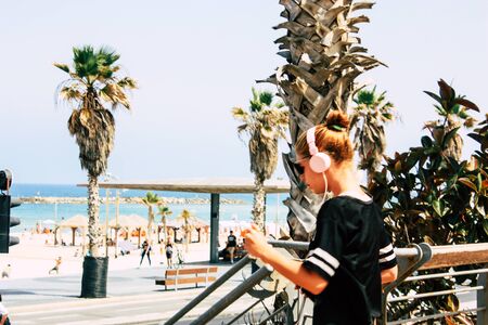 View of unknown Israeli people walking in the streets of Tel Aviv in the afternoon