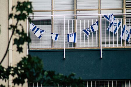 View of the Israeli flag in the streets of Tel Aviv in the afternoonの写真素材