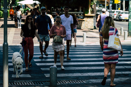 Tel Aviv Israel June 10, 2019 View of unknown Israeli people walking in the streets of Tel Aviv in the afternoonのeditorial素材