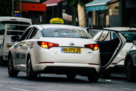 Tel Aviv Israel June 10, 2019 View of traditional taxi rolling in the streets of Tel Aviv in the afternoonのeditorial素材