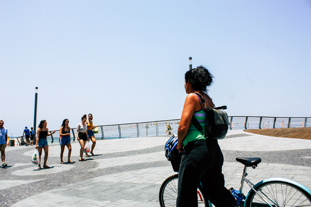Tel Aviv Israel June 10, 2019 View of unknown Israeli people rolling with a bicycle in the streets of Tel Aviv in the afternoonのeditorial素材