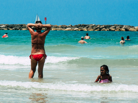 Tel Aviv Israel June 9, 2019 View of unknown Israeli children having fun on the beach of Tel Aviv in the afternoonのeditorial素材