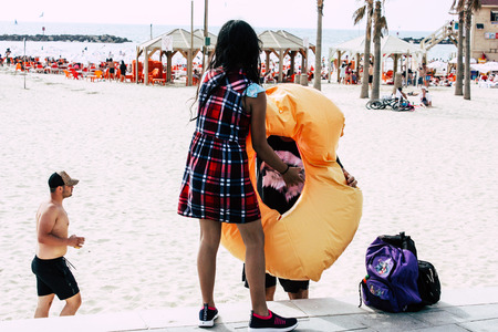 Tel Aviv Israel June 8, 2019 View of unknown Israeli children having fun on the beach of Tel Aviv in the afternoonのeditorial素材