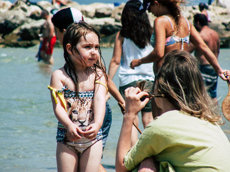 Tel Aviv Israel June 9, 2019 View of unknown Israeli children having fun on the beach of Tel Aviv in the afternoonのeditorial素材