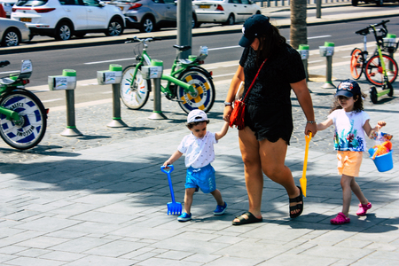 Tel Aviv Israel June 9, 2019 View of unknown Israeli people having fun on the beach of Tel Aviv in the afternoonのeditorial素材