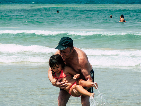 Tel Aviv Israel June 9, 2019 View of unknown Israeli children having fun on the beach of Tel Aviv in the afternoonのeditorial素材